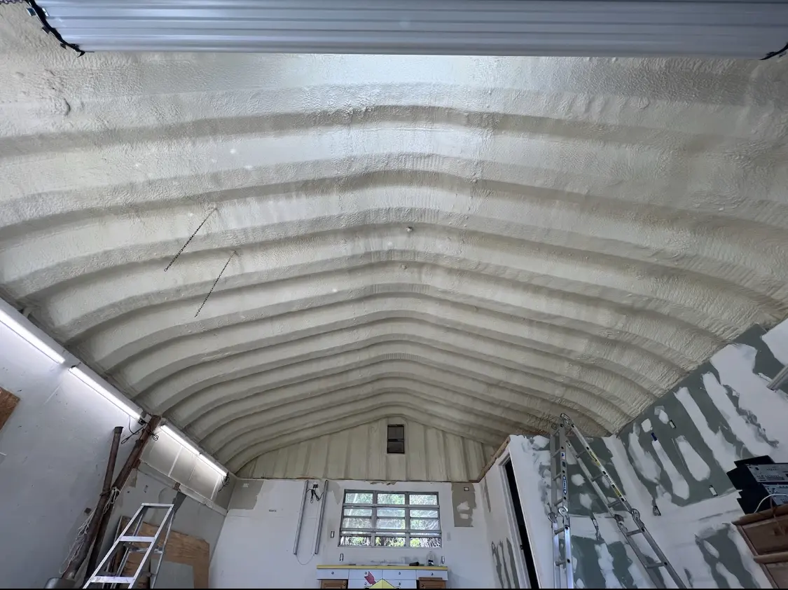 Spray polyurethane foam applied to the underside of a metal roof deck in South Milwaukee